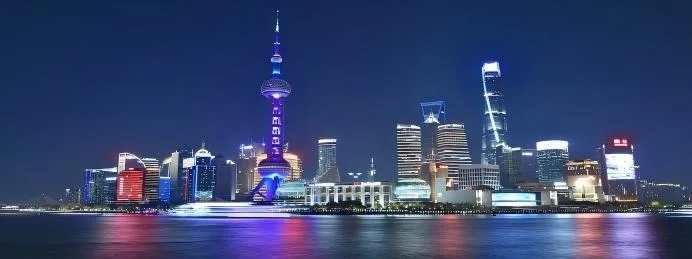 Shanghai skyline at night along the Huangpu River